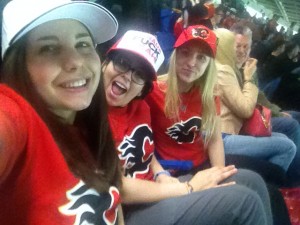 Sydney, at left, at a Calgary Flames game with fellow Mobilizers.